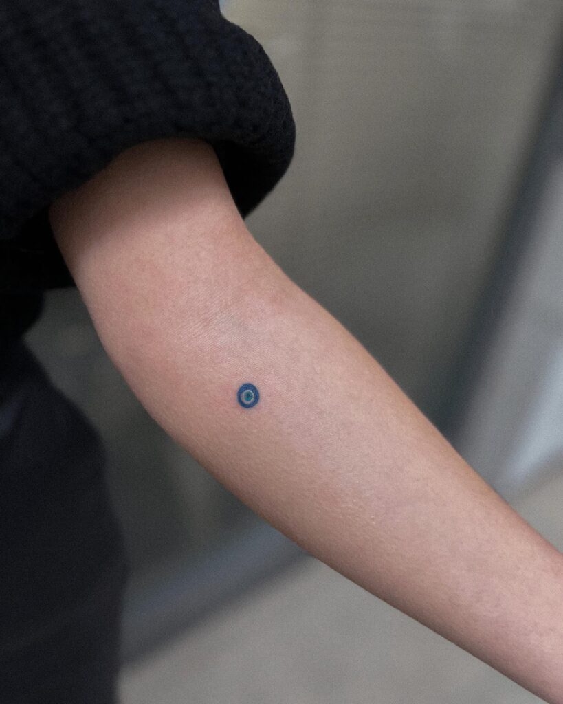 Evil Eye Tattoo Vibrancy on the Forearm: Colorful Gaze