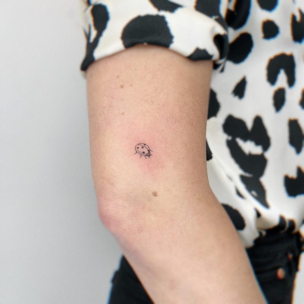 Exploring the ladybug tattoo trend tattoo above the elbow