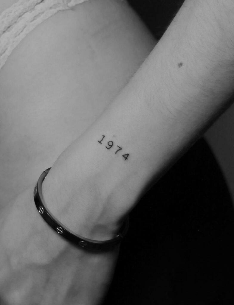 Exploring the Significance of a Number Tattoo on the Outer Wrist: 1974 Fineline Tribute