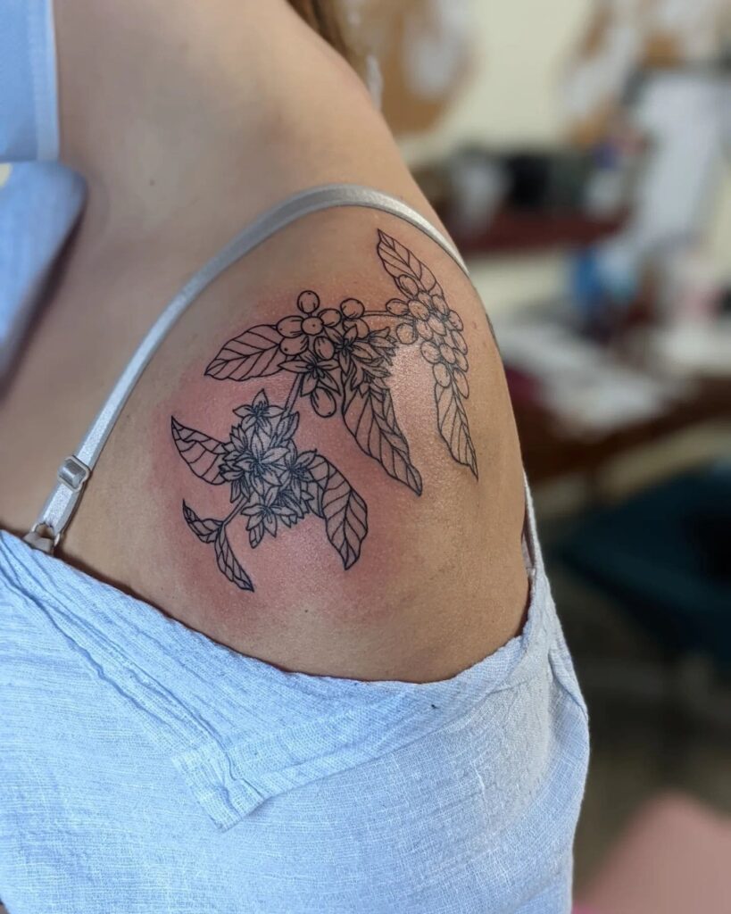 Exquisite botanical coffee plant tattoo on shoulder