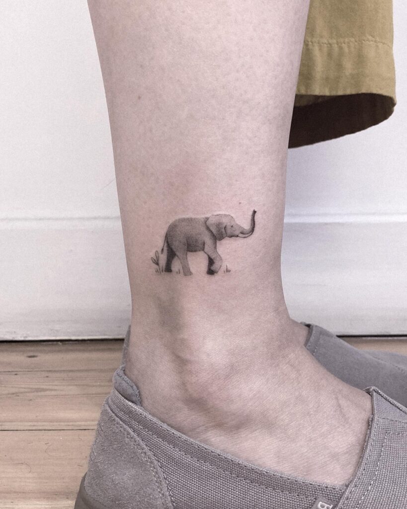 Exquisite side view tattoo above the ankle for subtle charm: tiny elephant magic