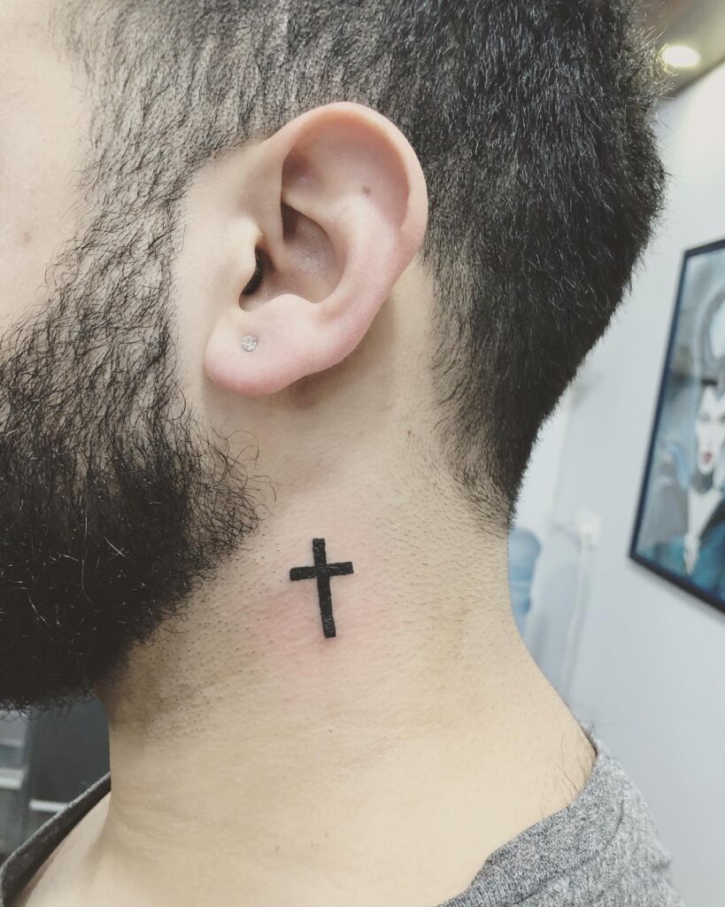 Eye catching behind the ear simple cross men's tattoo