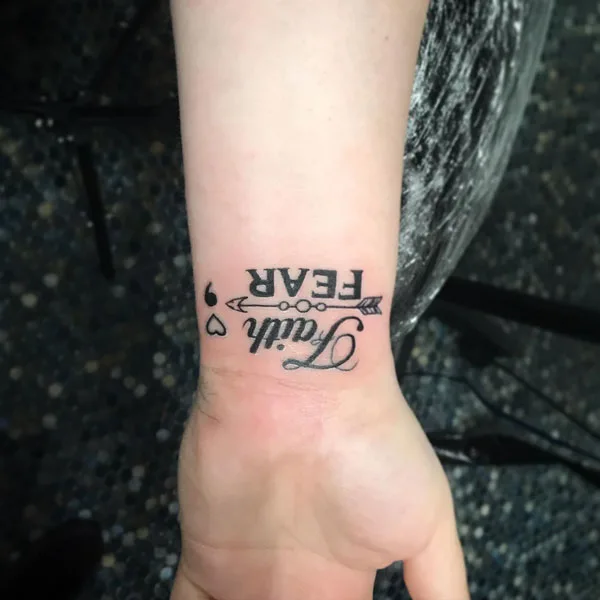 Faith over fear tattoo wrist