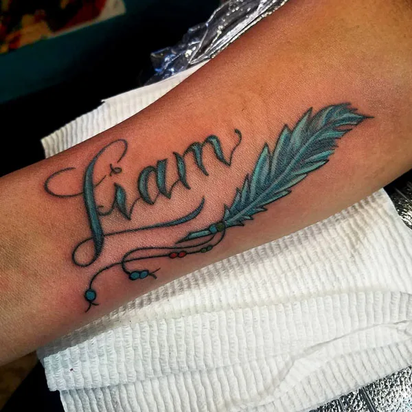 Feather name tattoo