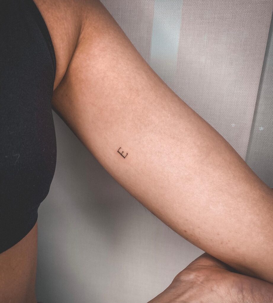 Feminine 'E' Letter Tattoo on the Bicep: Bicep Beauty
