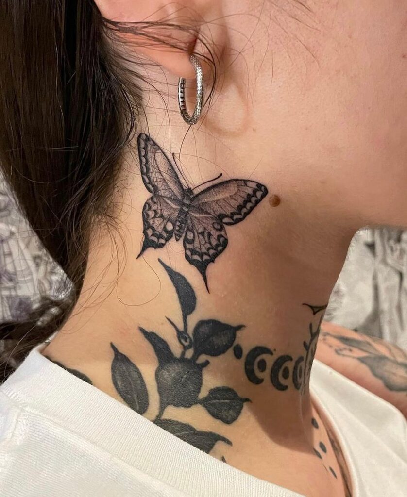 Feminine grace girly swallowtail butterfly tattoo behind the ear