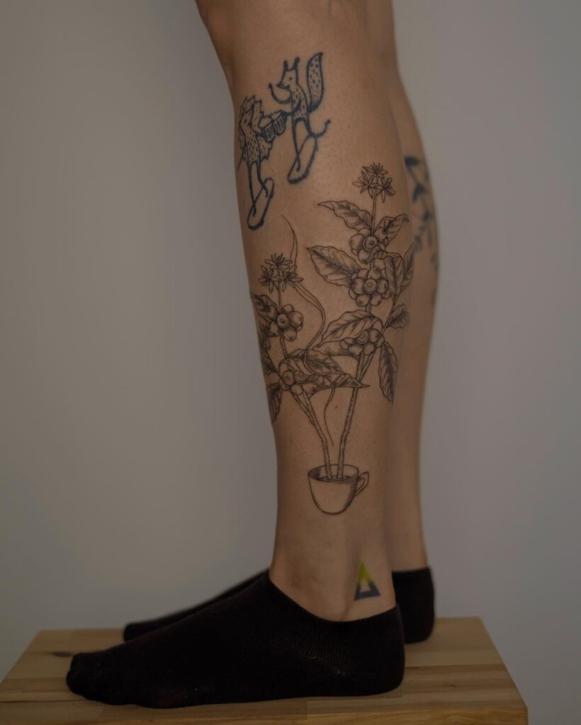 Fine Line Coffee Plant Tattoo on Calf Subtle Sophistication