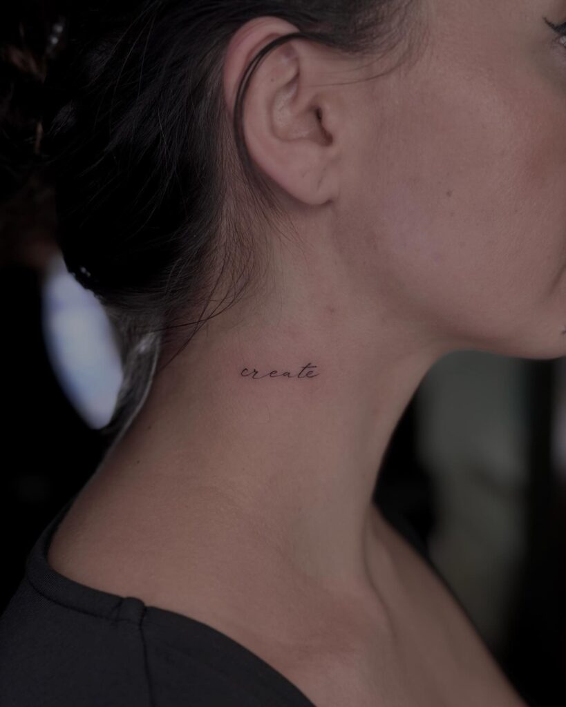 Fine line lettering tattoo, a dainty addition to the side neck 'create' delicacy