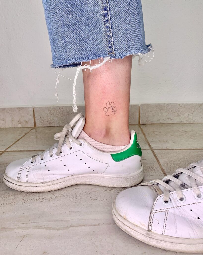 Fine Line Paw Tattoo Above the Ankle for a Minimalist Touch: Ankle Elegance