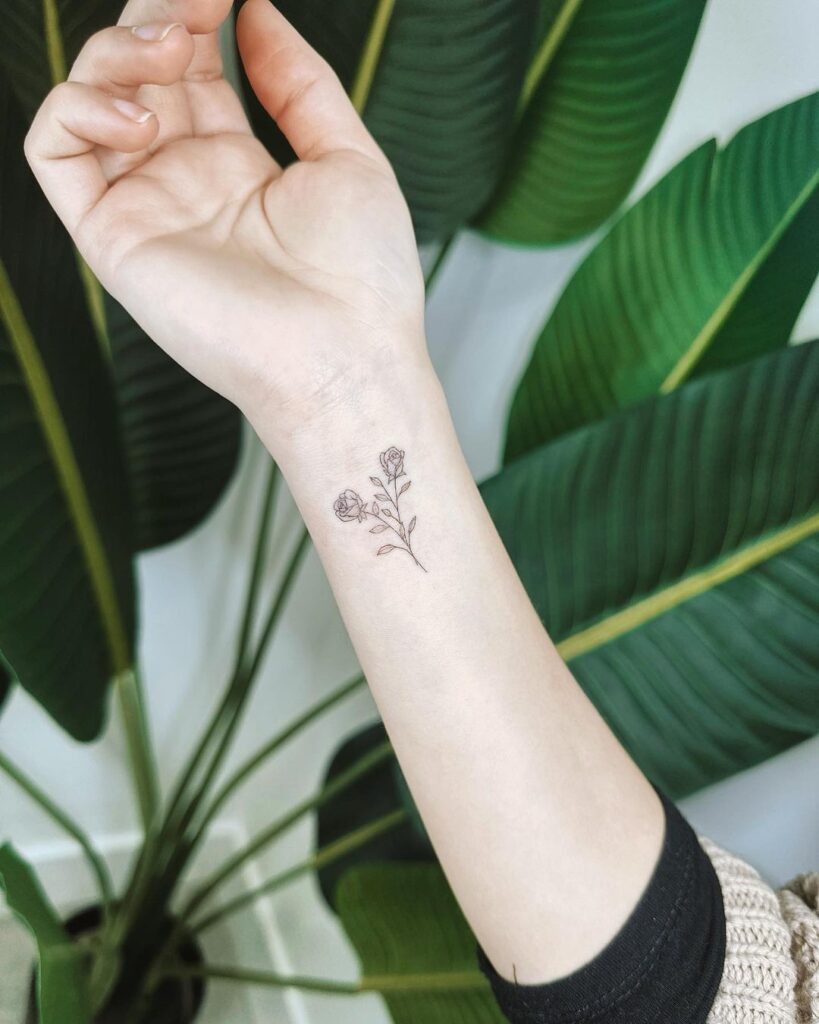 Fine line tiny wrist dainty rose tattoo a subtle floral design