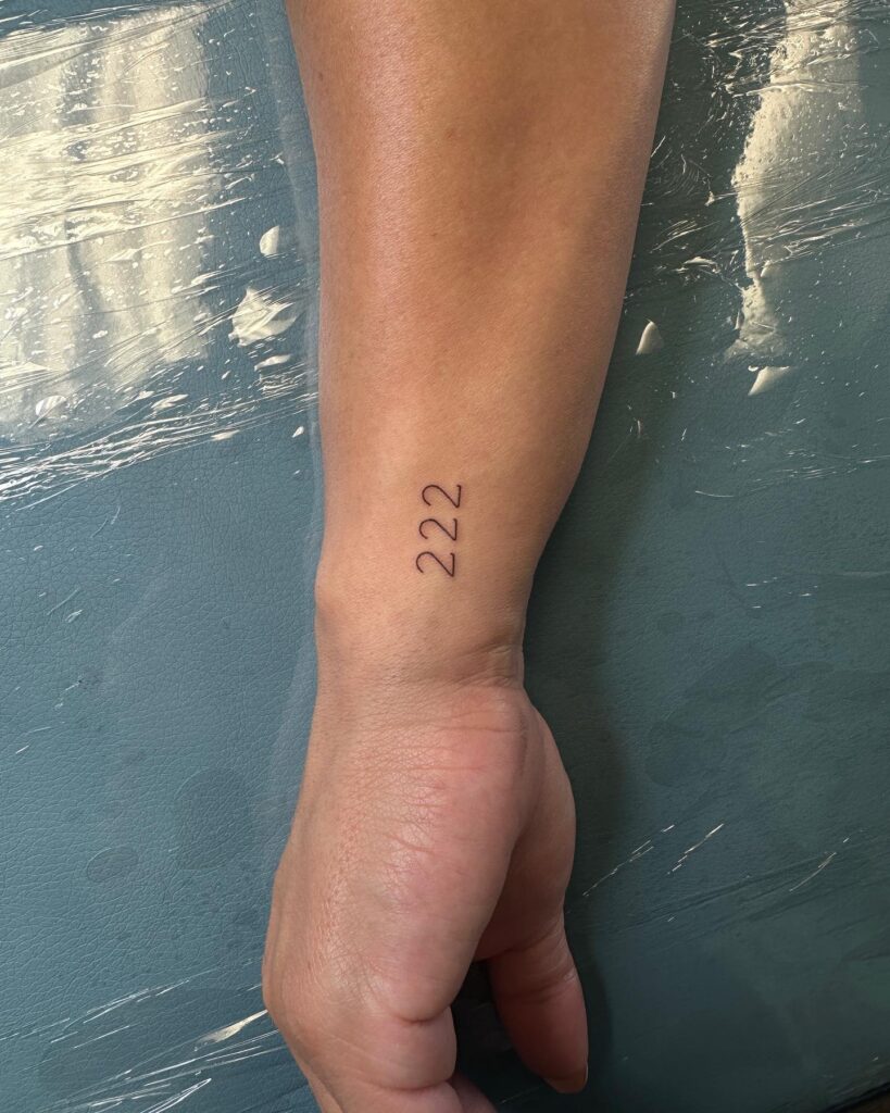 Fineline '222' Tattoo on the Side of the Wrist, a Delicate Design: Fine and Defined 