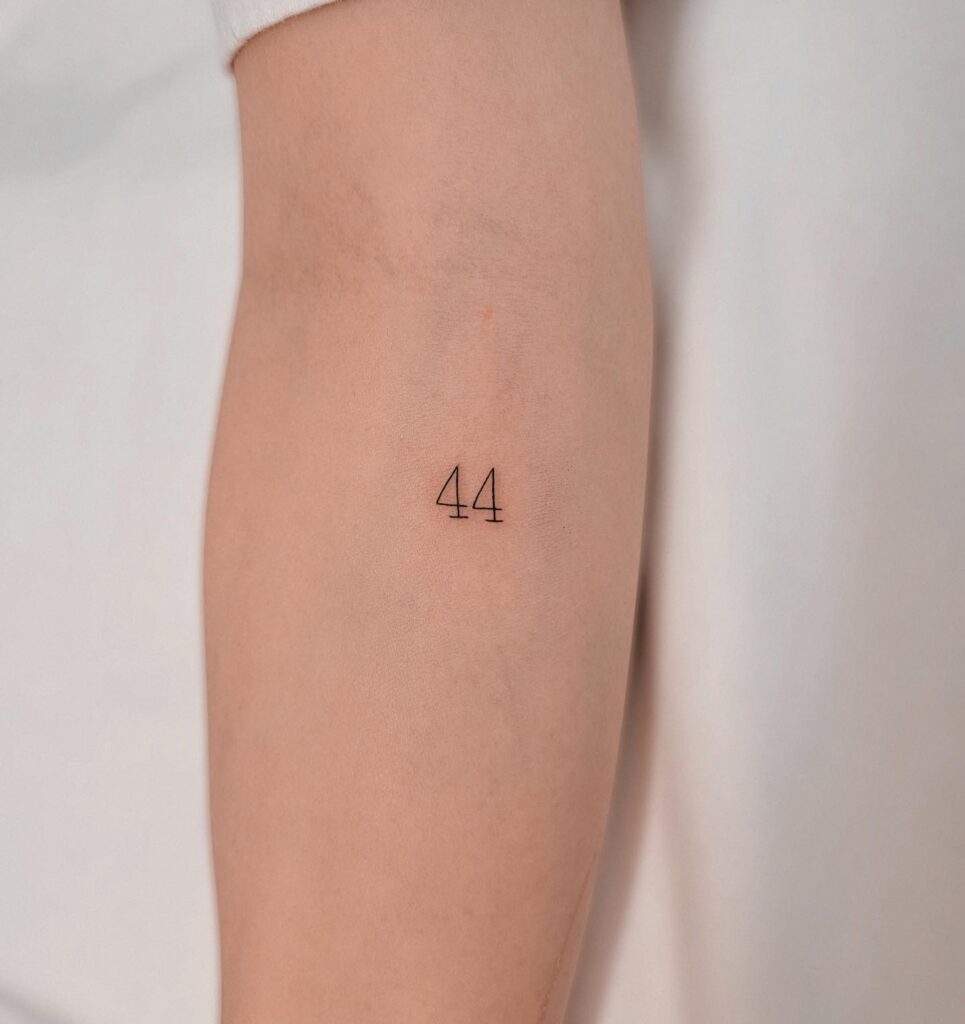 Fineline 44 Number Tattoo on the Forearm: Numerical Charm