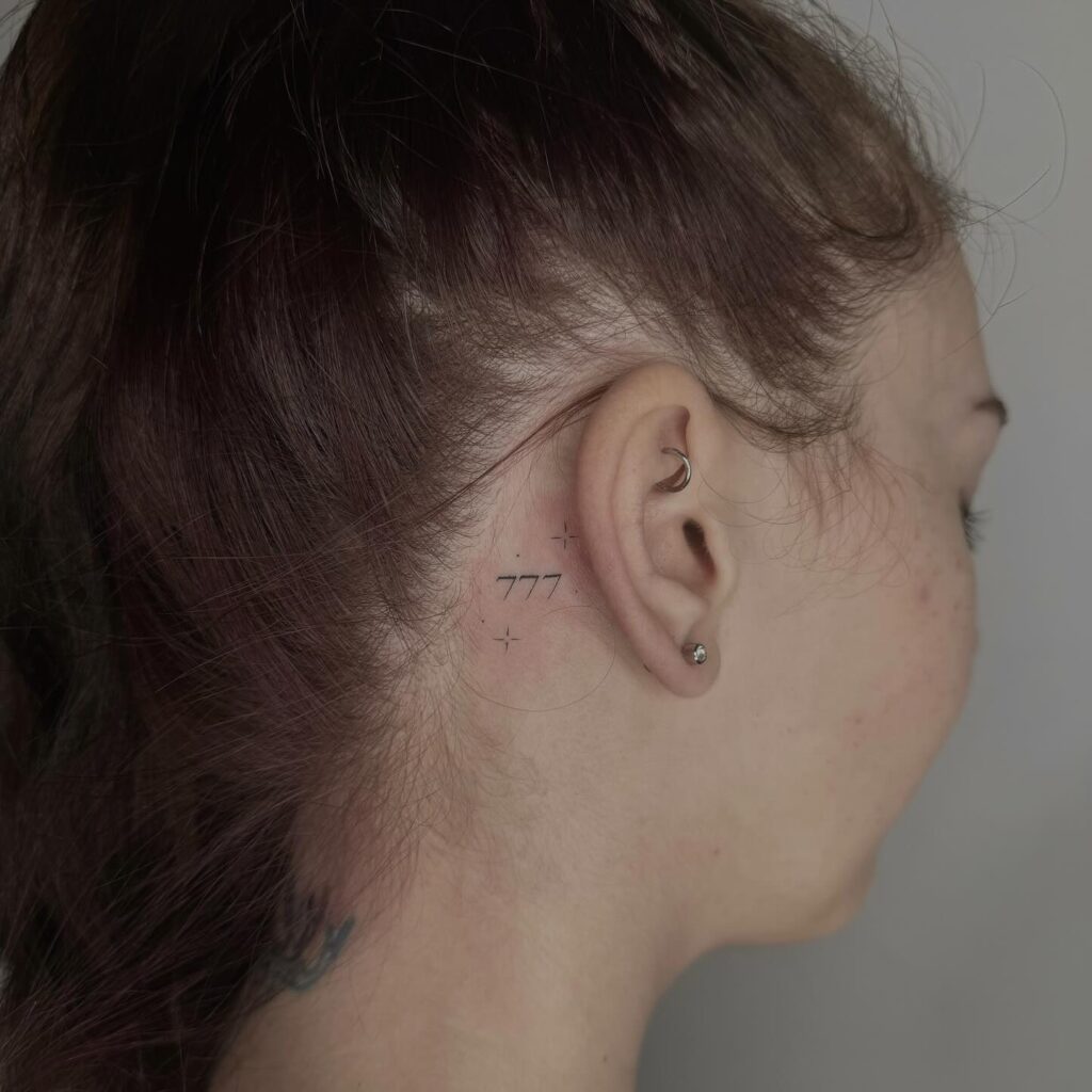 Fineline 777 Tattoo Behind the Ear for a Subtle Touch: Whispering Secret 