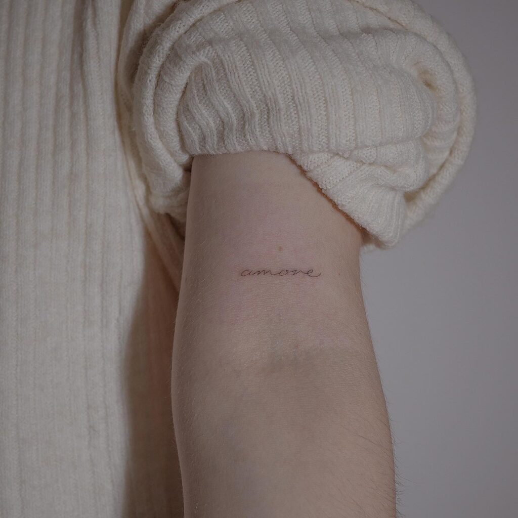 Fineline 'Amore' Script Tattoo Above the Elbow: Italian Elegance