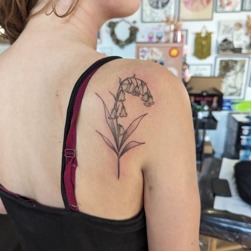 Fineline bluebell tattoo behind the shoulder elegant ink