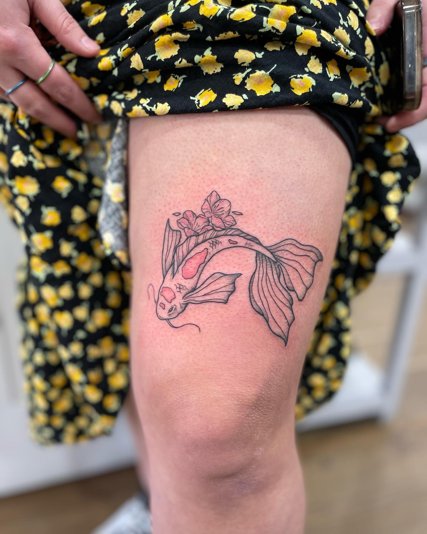 Fineline Koi Fish With Red Ink Above Knee Tattoo Design