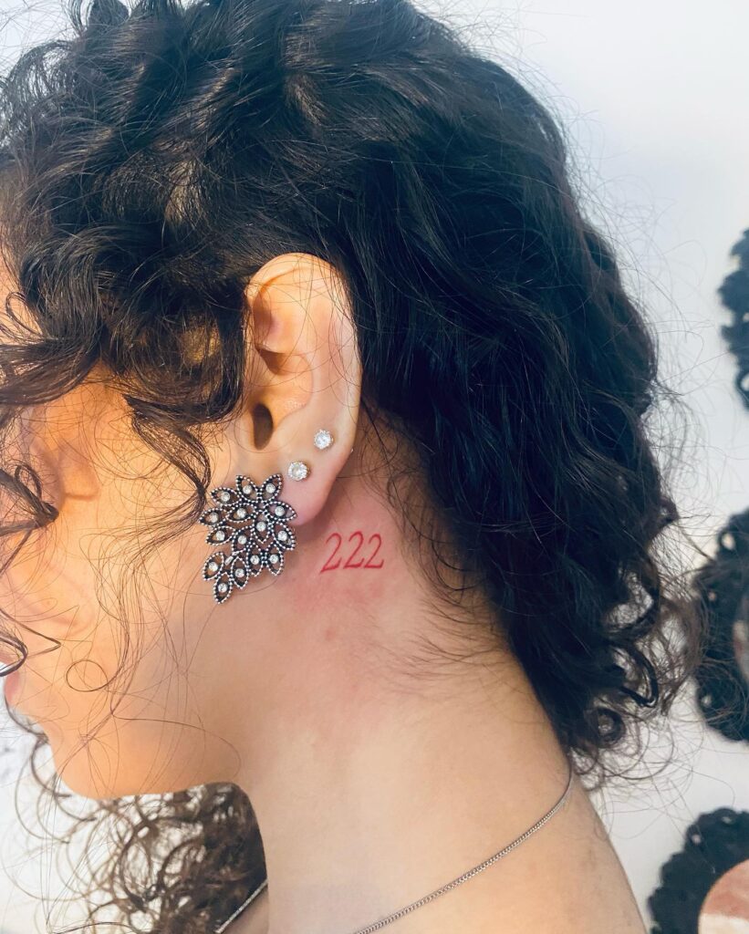Fineline Red Color 222 Tattoo on the Behind the Ear for Women, a Delicate Accent: Behind-the-Ear Elegance 