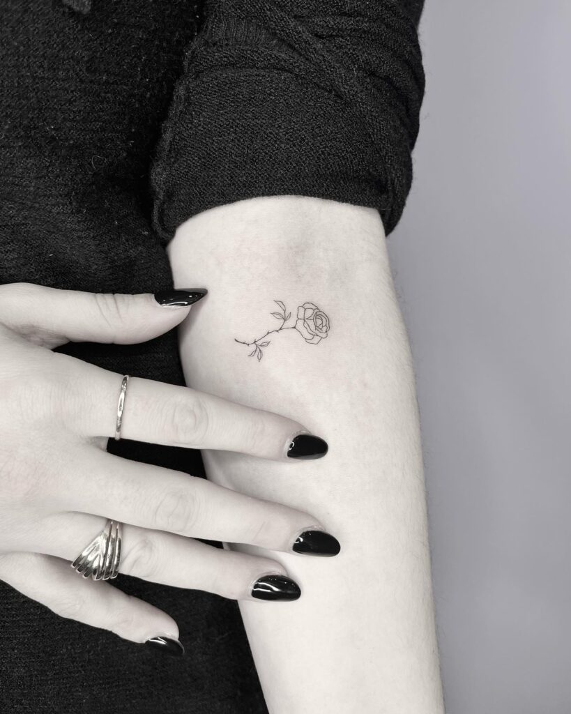 Fineline Rose Tattoo on the Elbow Minimalist Tattoo: Eternal Beauty