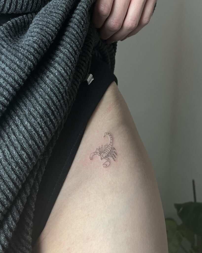Fineline Scorpio Tattoo on the Hip, a Cosmic Accent of Astrological Charm: Zodiac Chic