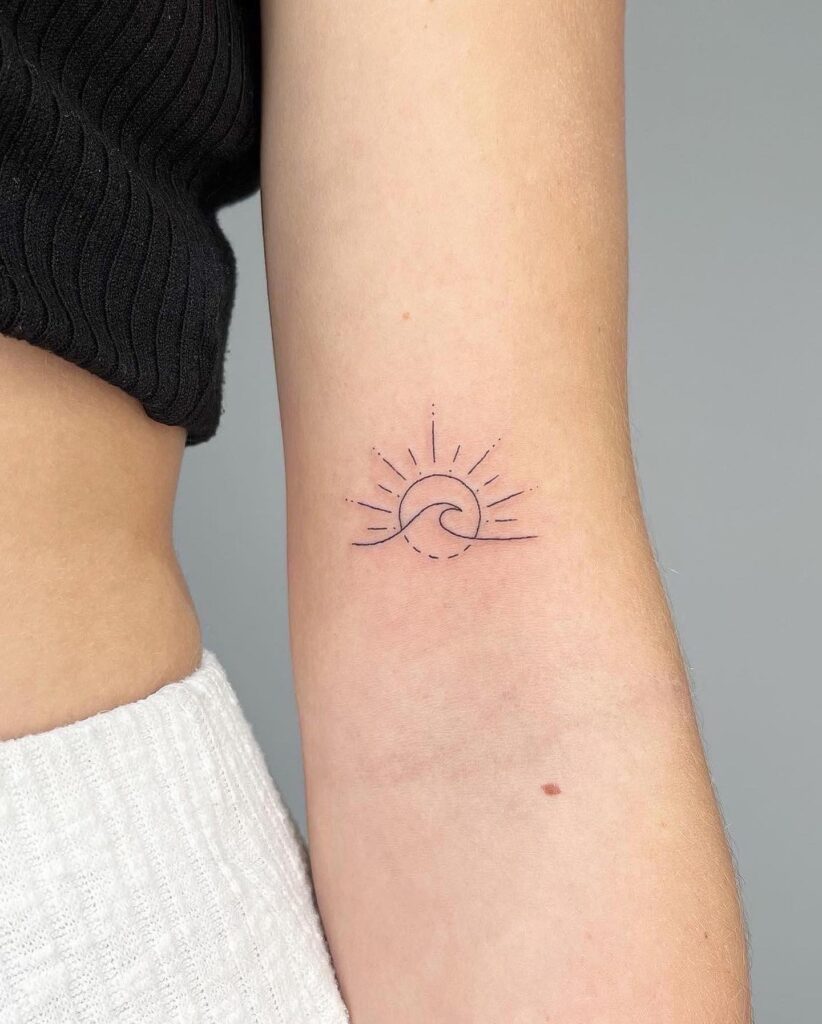 Fineline Sun and Wave Tattoo Above the Elbow: Sun-Kissed Waves