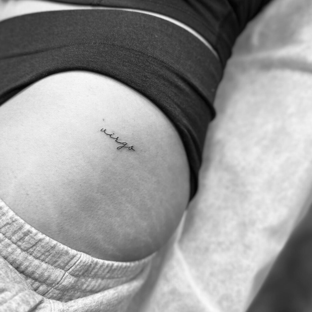 Fineline 'Virgo' Script Lettering Tattoo on the Hip, Celestial and Personalized: Astrological Grace