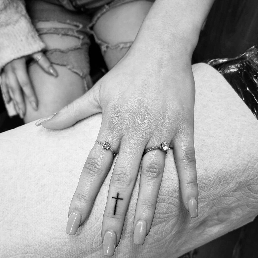 Finger symbolism simple cross tattoo for girls