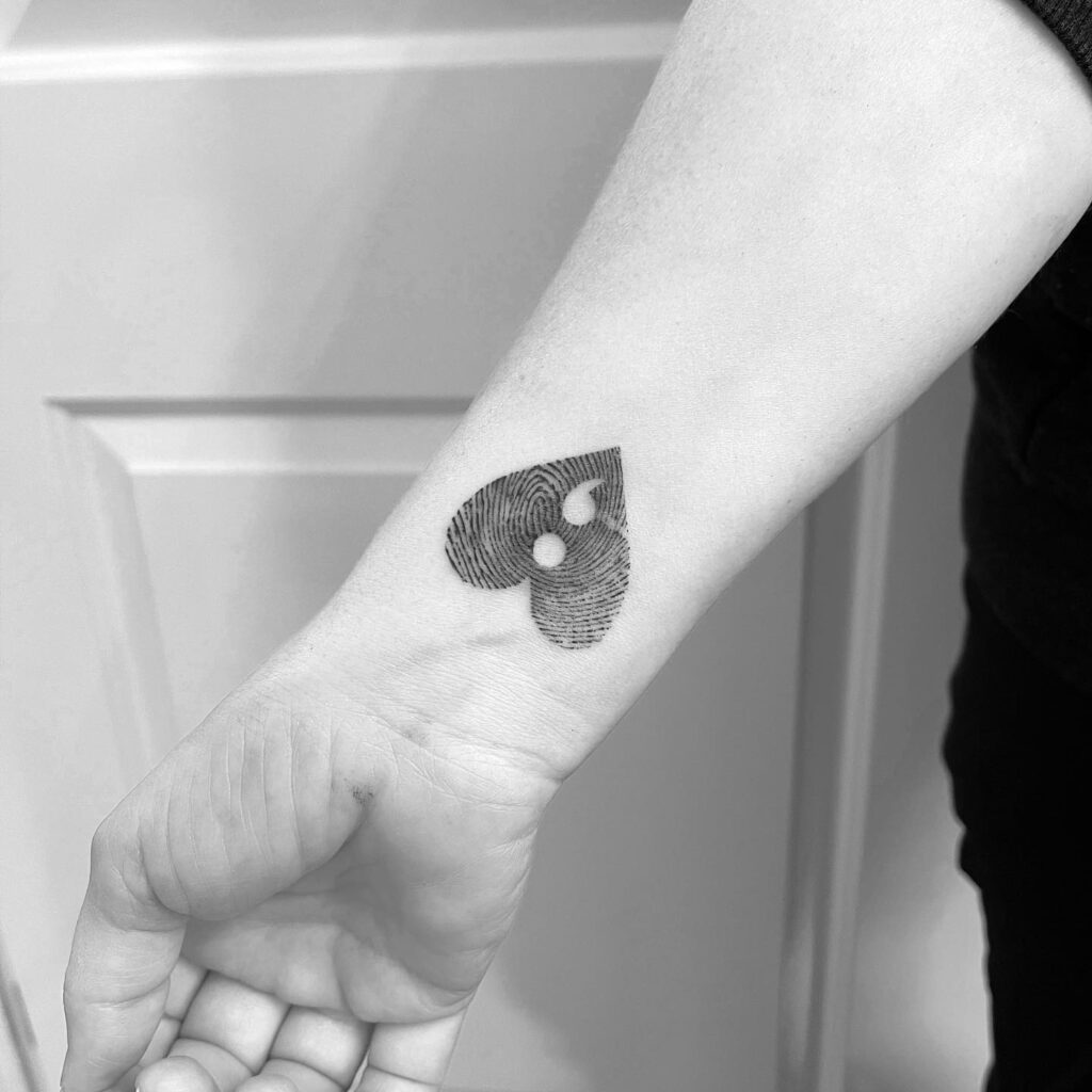 Fingerprint Heart with a Semicolon on Inner Wrist: Heartbeat Pause