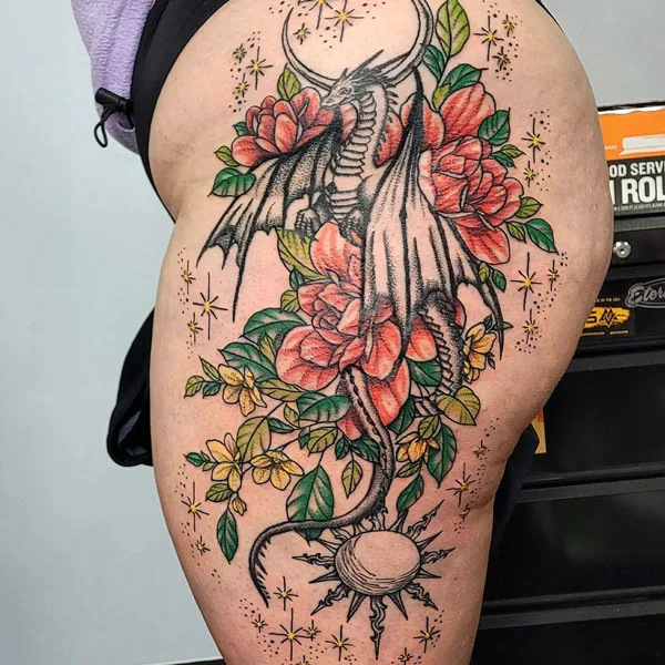 Floral Dragon tattoo on thigh
