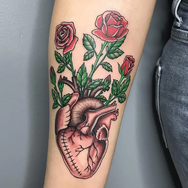 Floral anatomical heart tattoo