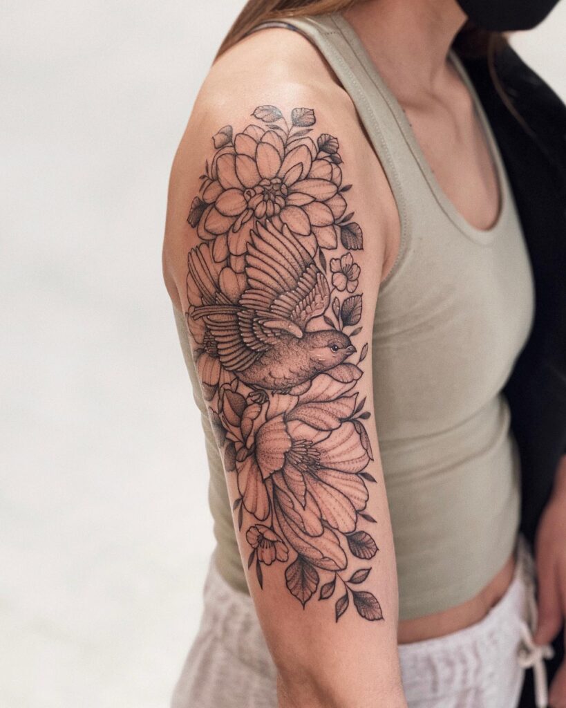 Floral aviary half sleeve tattoo with birds: nature's symphony on skin