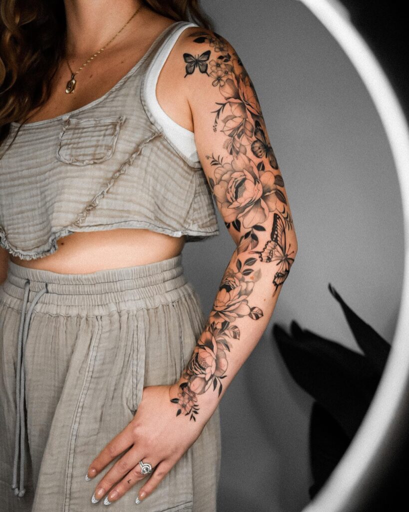 Floral splendor full sleeve flower and butterfly tattoo for women