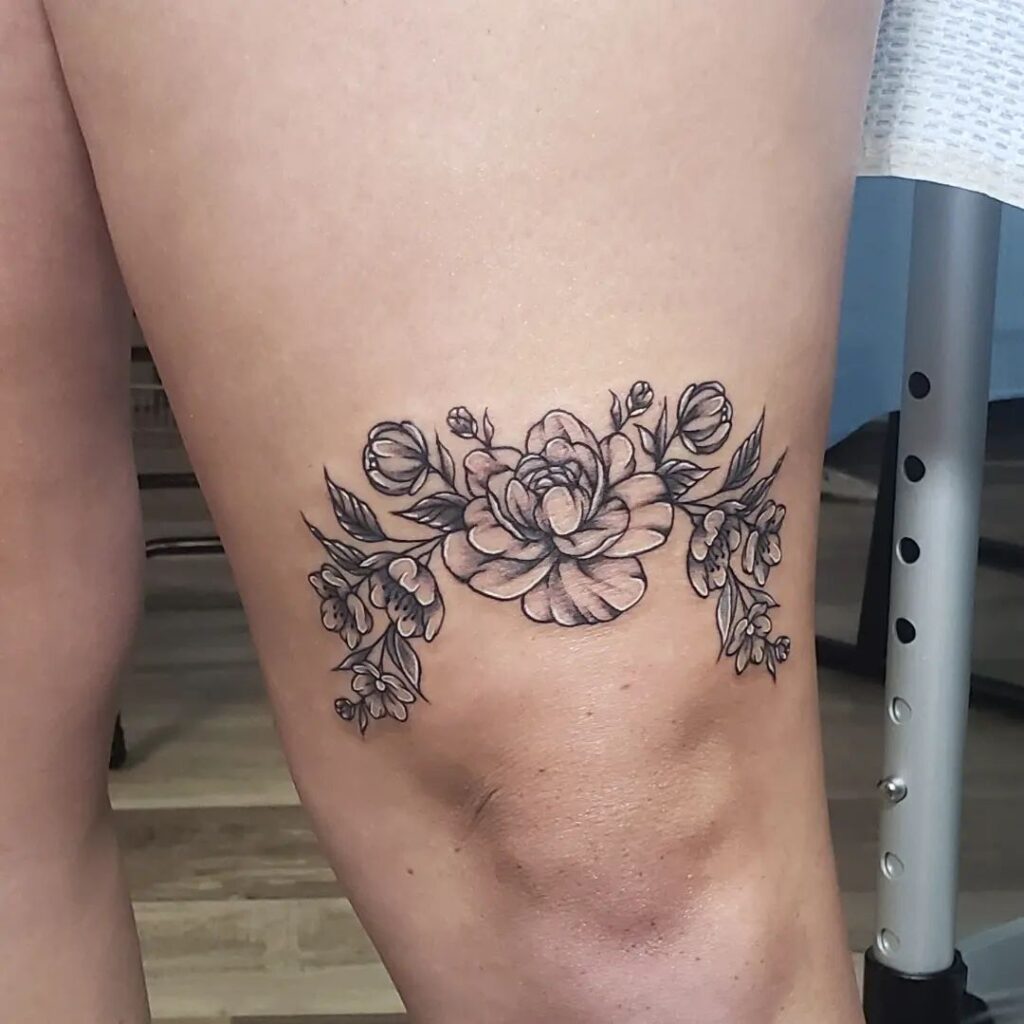 Floral Tattoo Above the Knee: Feminine Design for Women
