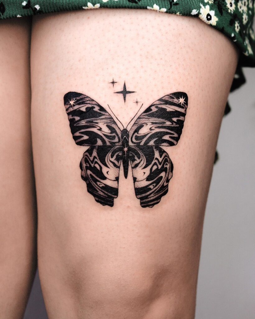 Flowing butterflies and stars celestial beauty on your thigh