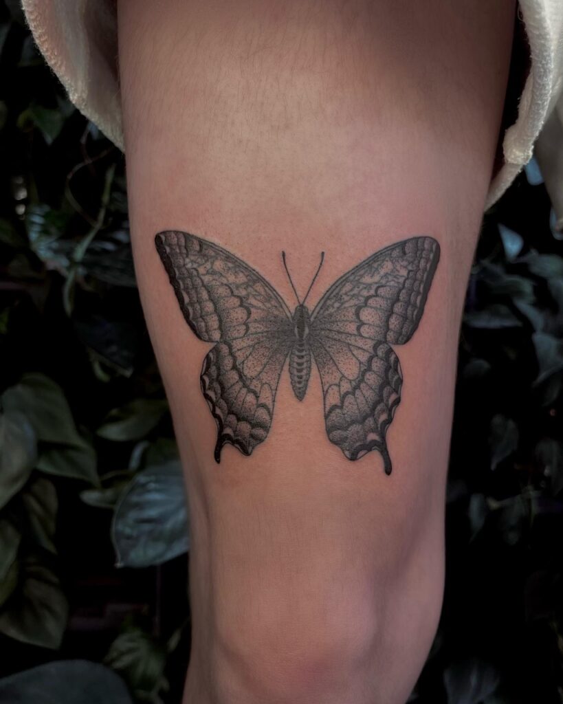 Fluttering beauty swallowtail butterfly tattoo ideas above the knee
