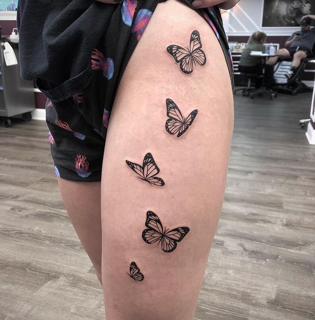Black Ink Flying Onwards Butterflies Tattoo for Thigh