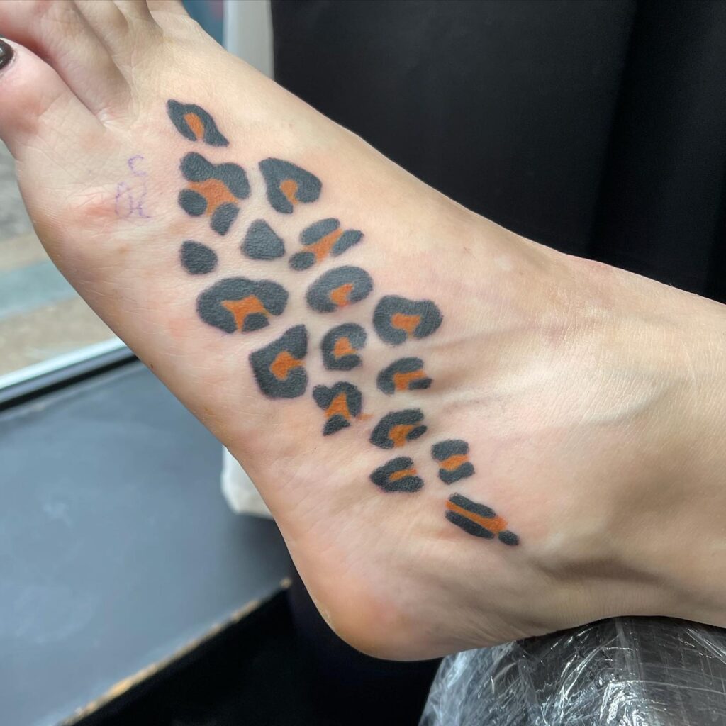 Foot fascination captivating leopard print tattoos