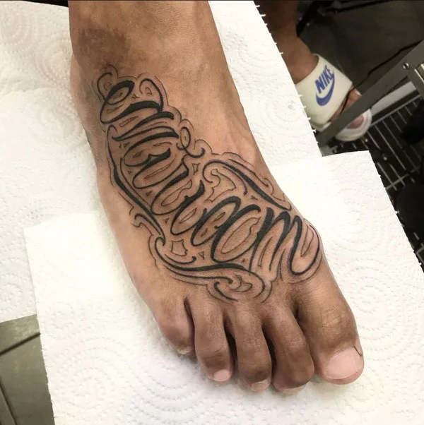 Foot name tattoo