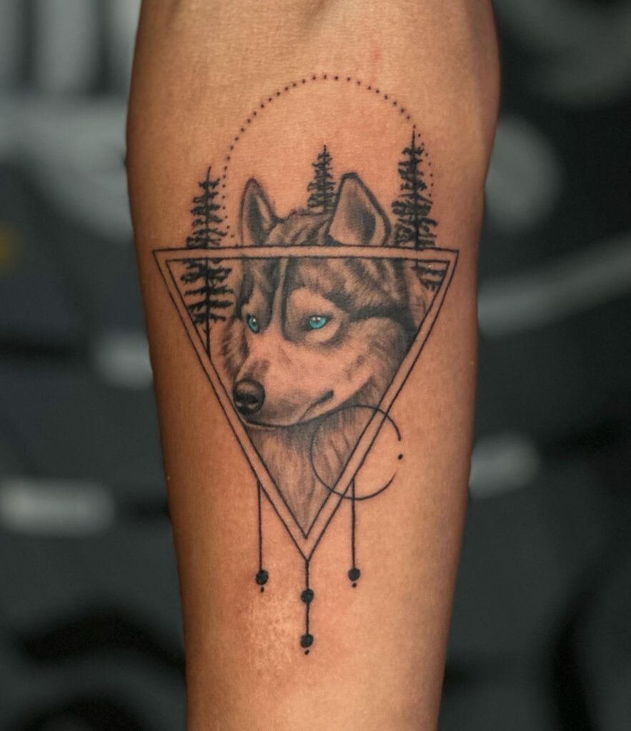 Forearm art for men captivating realistic wolf tattoo with green eyes