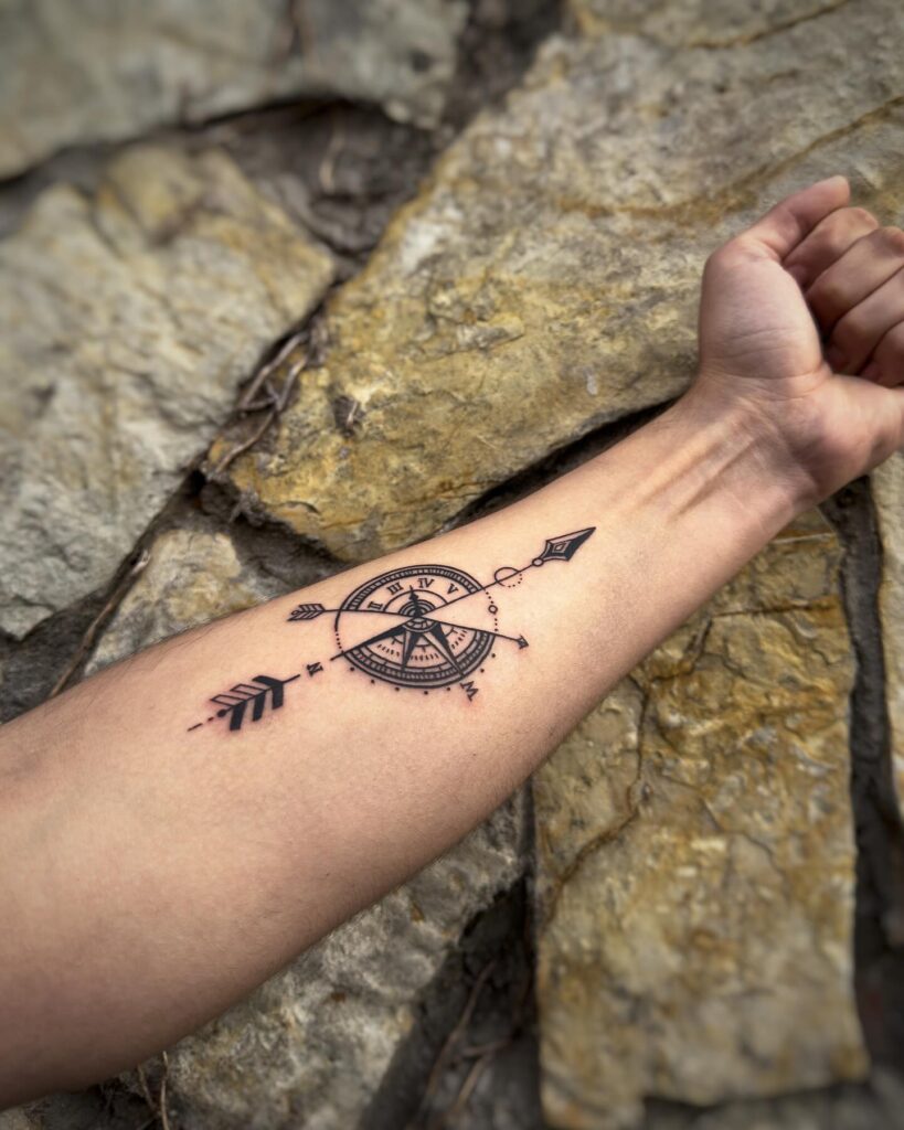 Forearm compass and arrow tattoo for navigation vibes: arrow of direction