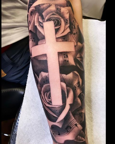 Forearm Cross With Rhythmic Roses Tattoo Design