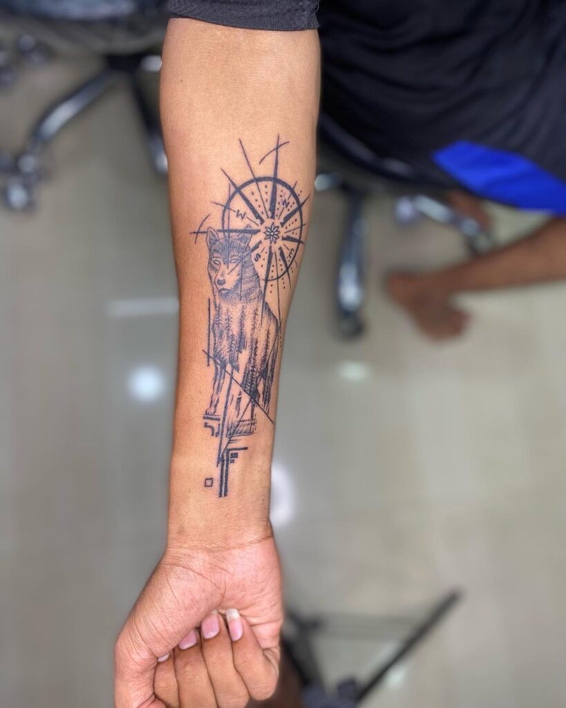 Forearm tattoo elegance the ferocious wild wolf with a compass