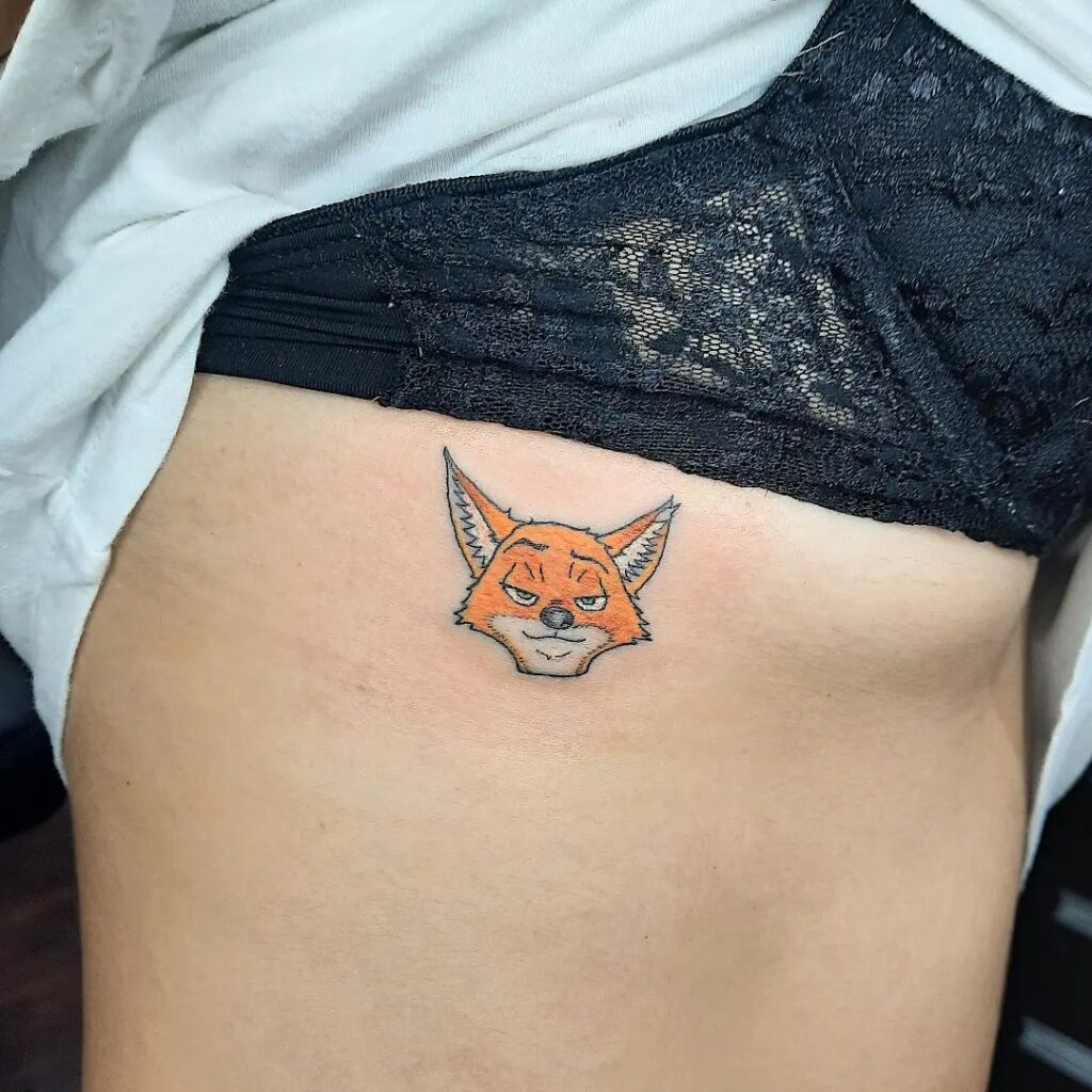 Fox Face Tattoo on the Rib with Vibrant and Colorful Artistry: Cartoon Colorburst