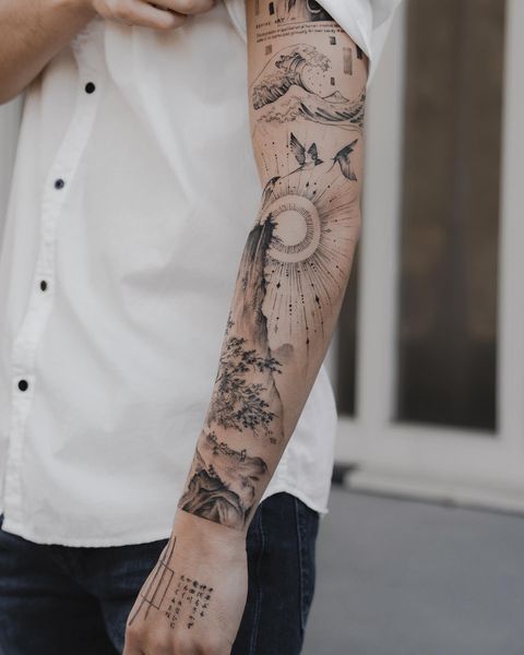 Full Hand Scenery With Wave And Sun Tattoo Art