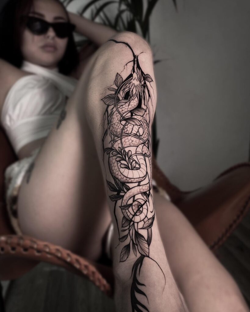 Full Lower Leg Tattoo of a Dragon with Vine, Bold Black Ink Design: Dragon's Embrace