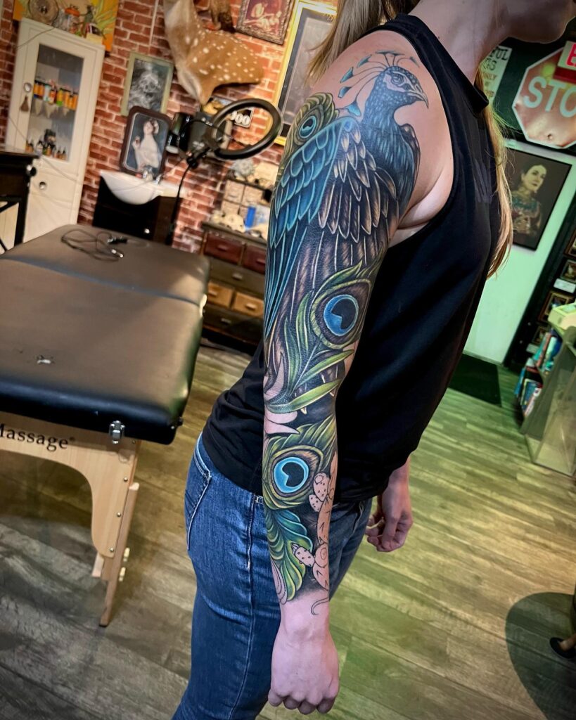 Full Sleeve Peacock and Peacock Feather Tattoo for Women : Intricate and Aesthetic