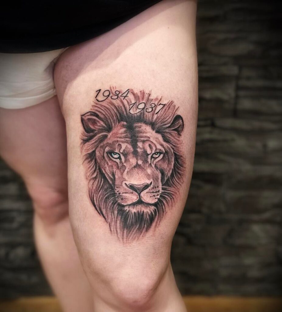 Fully covered lion face tattoo on the thigh with historical years: thigh majesty