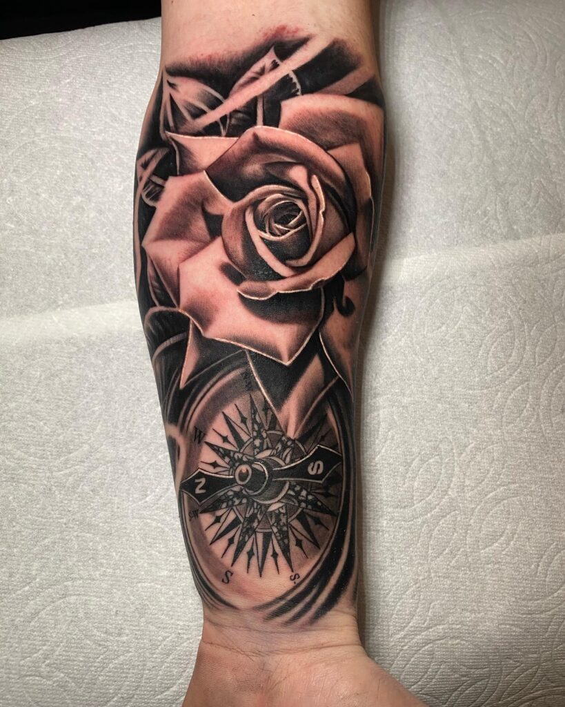 Fully Covered Rose with Compass Tattoo on the Forearm in Blackwork: Rose Compass Odyssey