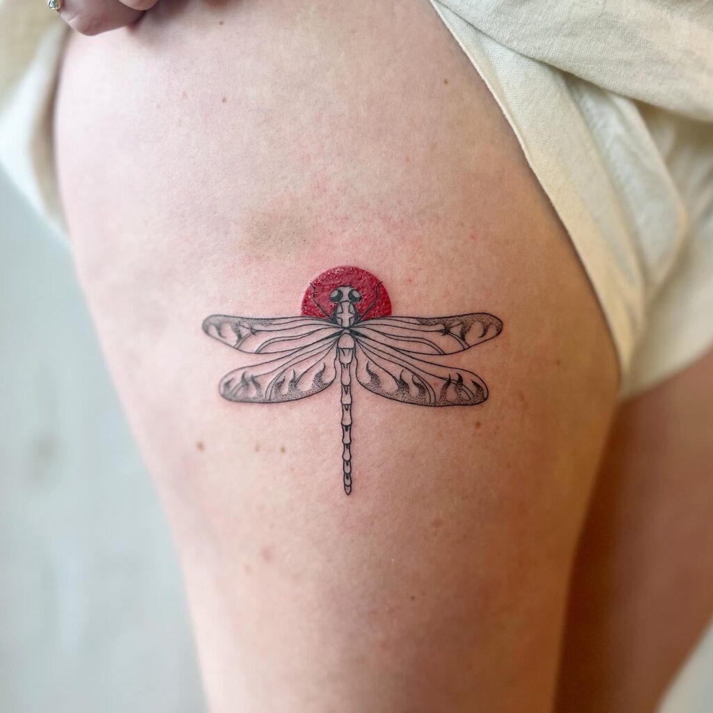 Funky lil dragonfly a quirky thigh tattoo design
