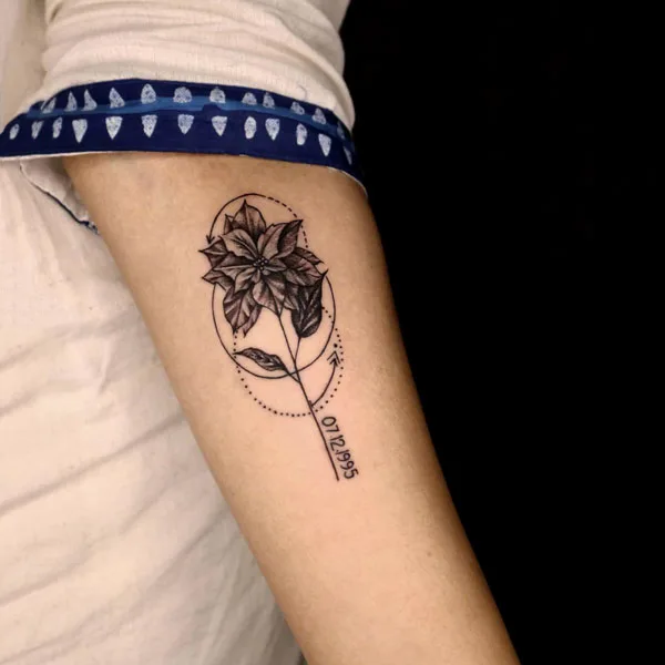 Geometric December birth flower tattoo