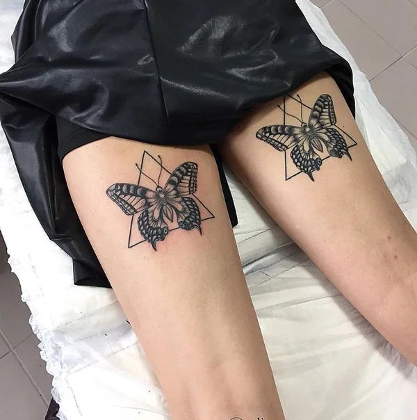 Geometric butterfly thigh tattoo